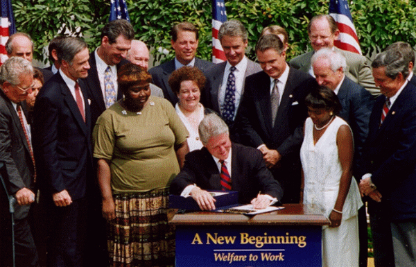 President Clinton signs the 1996 PRWORA legislation.